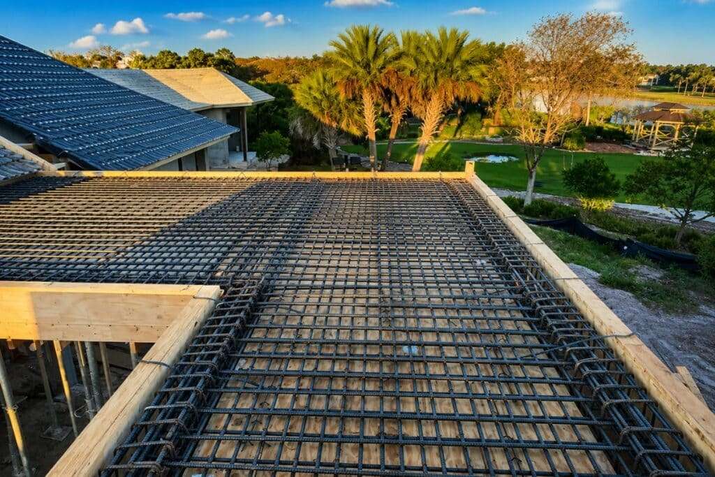 Steel rebar reinforcement for a luxury custom home's concrete floor system under construction by Ronin Development in South Florida