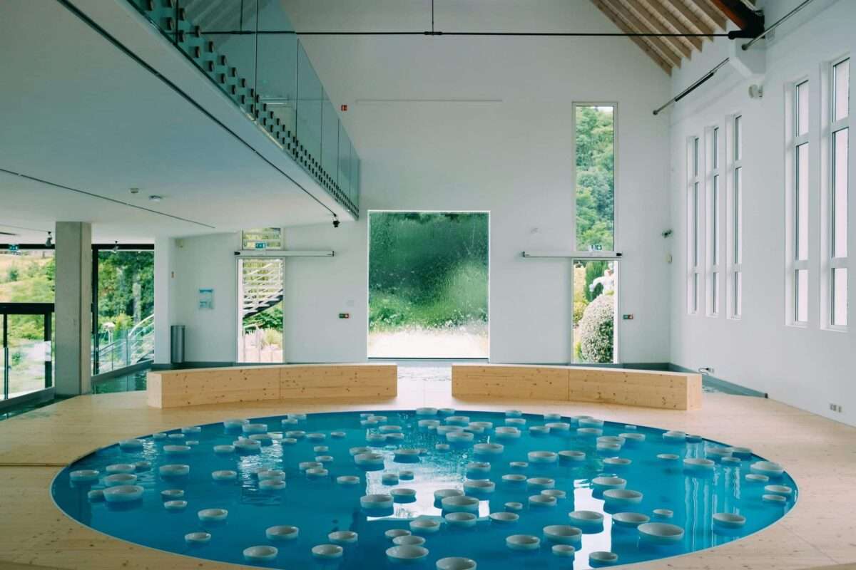 Luxury indoor water therapy pool in a contemporary wellness space