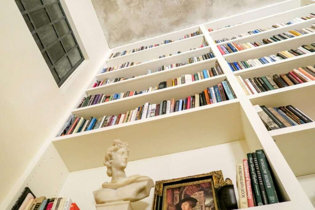 Luxury Home Library with Floor to Ceiling Custom Bookshelves