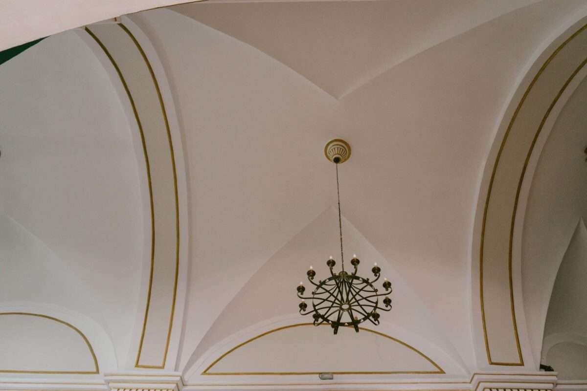 Luxury home ceiling design with vaulted architectural details and chandelier