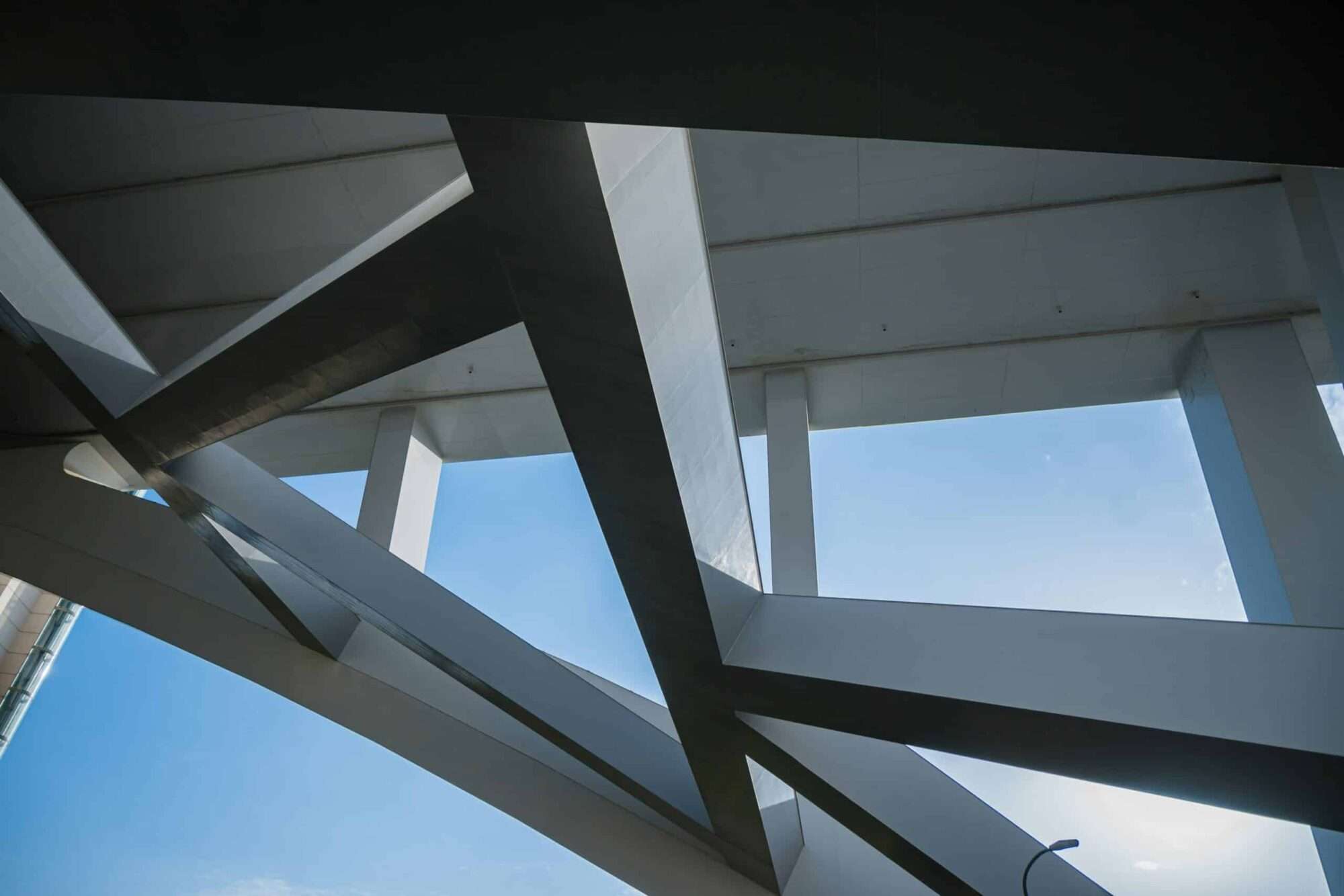 Complex structural beams and architectural framing illustrating the engineering behind luxury home construction