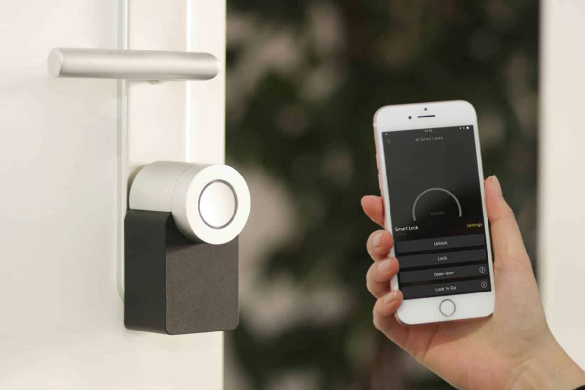 Smartphone controlling a smart door lock in a luxury home