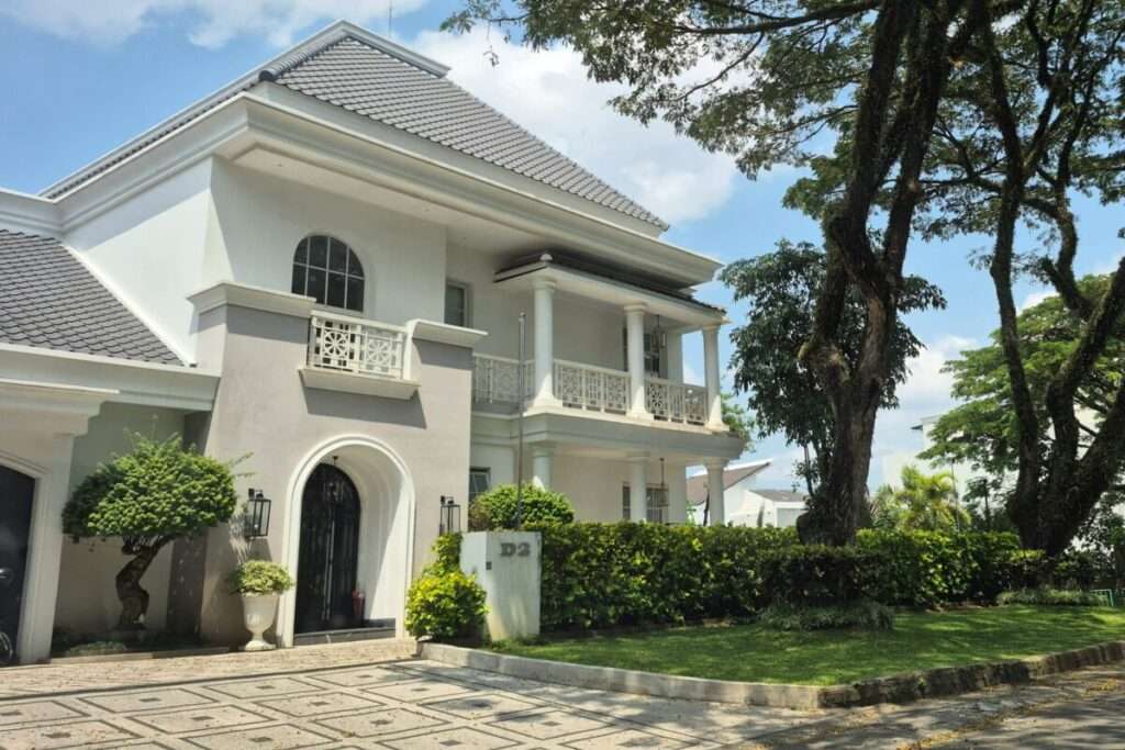 Luxury custom home exterior with landscaped grounds
